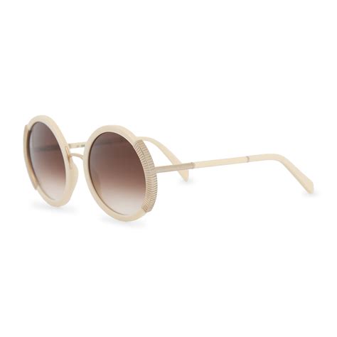 Lunettes de soleil rondes MU 11YS Femme .